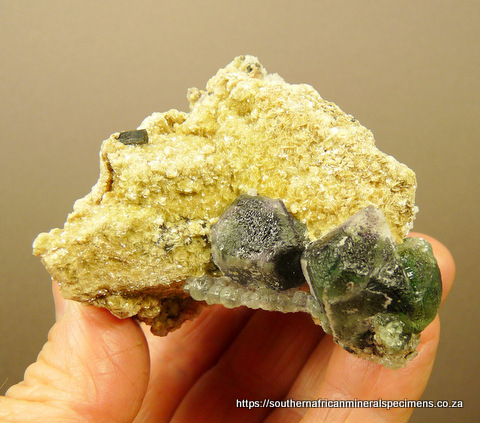 Fluorite and hyalite opal on matrix rich in mica and schorl