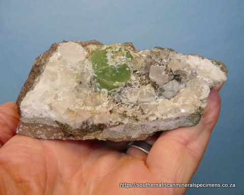 Green tourmaline crystals in quartz