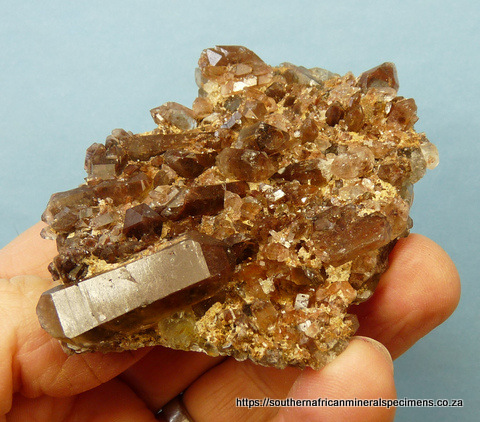 Plate of quartz crystals with hematite