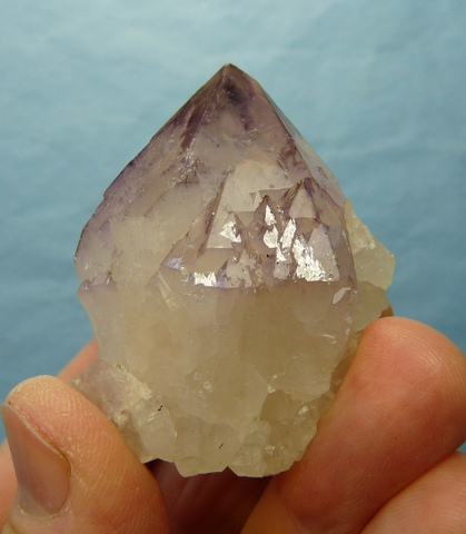 Complex quartz crystal with bits of amethyst and smoky colouring