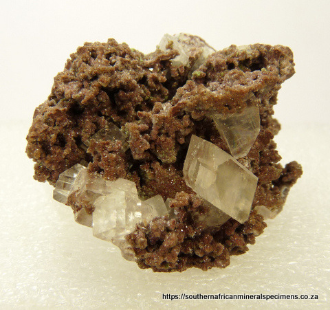 Well-formed, clear calcite crystals on crystallized dolomite matrix