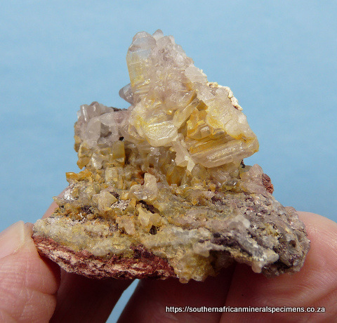 Calcite crystal group with duftite inclusions