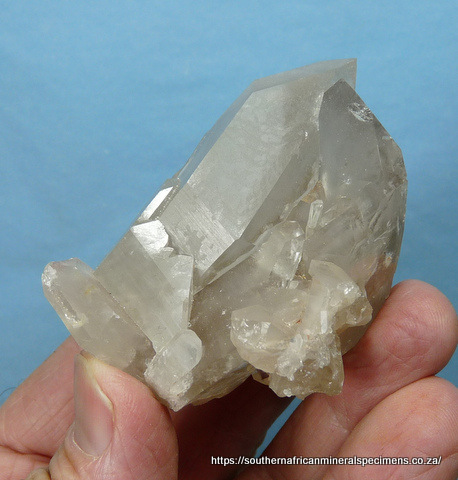 Pale prehnite blades cover pale amethyst quartz crystals